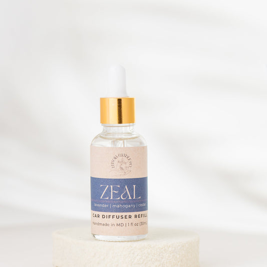 Bottle of 'ZEAL' ear diffuser refill on a white background