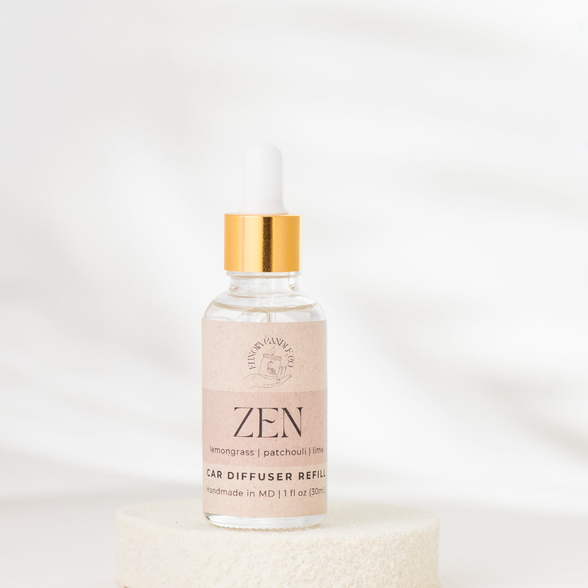 Bottle of 'Zen' diffuser refill on a white background